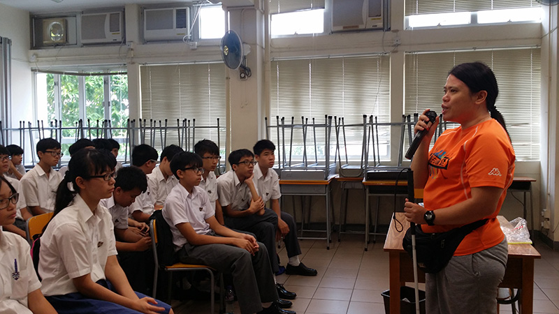 Visually impaired public education ambassador sharing with students at school