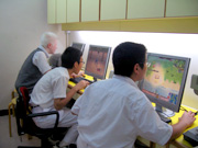 Visually impaired youths using computers at Information Technology Corner