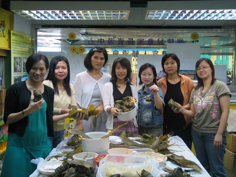 Parents joining an activity of making rice dumpling