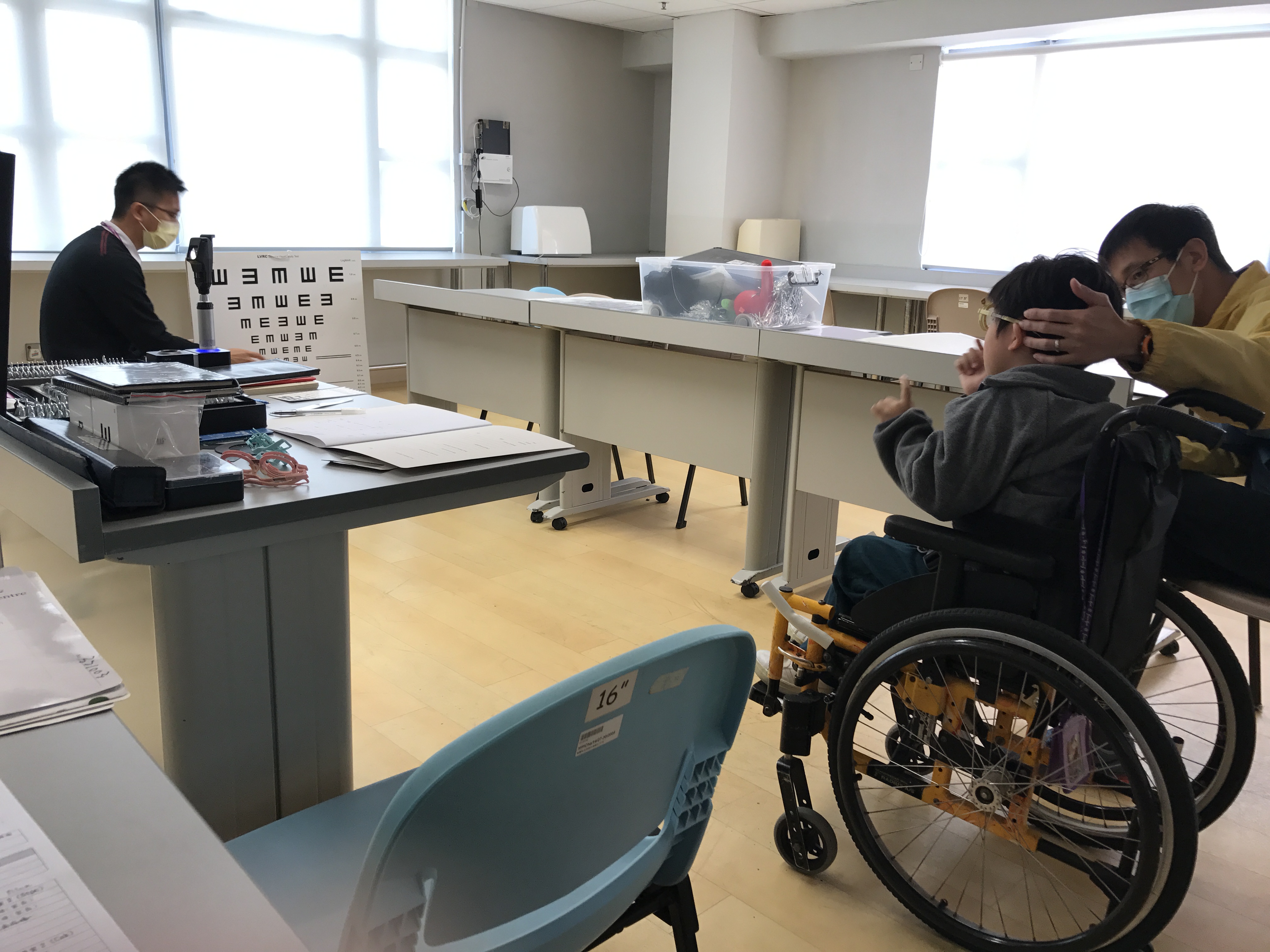 Optometrists conduct vision screening for wheelchair user