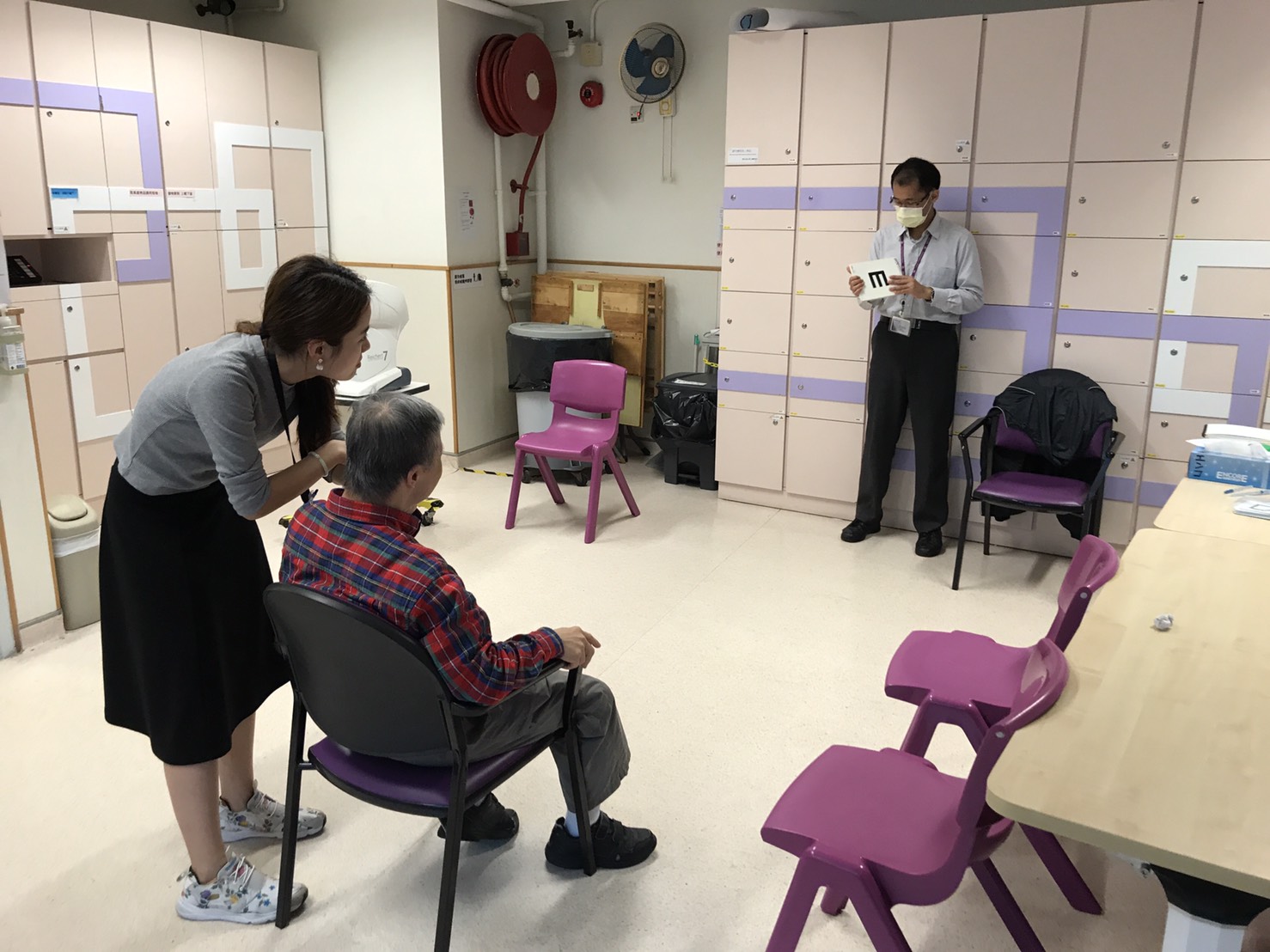 Optometrists conduct vision screening an elderly